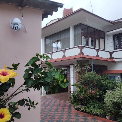 Saboath Homestay exterior beside the garden
