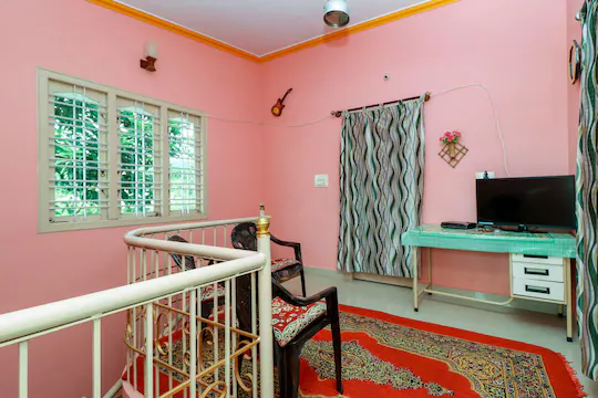 Lobby lounge and television area at Saboath Homestay